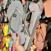 Chinelo Havaianas Slim Sparkle II + Pingente de Olho Grego